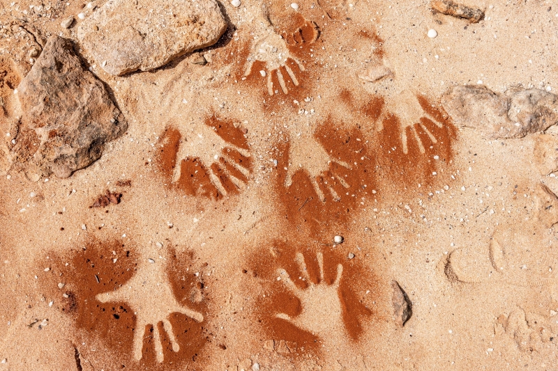 Handprint artwork in the bay sand, Wula Gura Nyinda Eco Cultural Adventures, Denham, Shark Bay, Western Australia © Tourism Australia